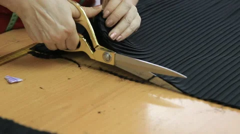 Tailor working in the laboratory with scissors on table Stock Footage 62350748