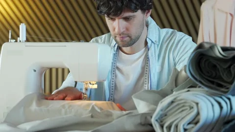 Tailor working on a sewing machine at the sewing workshop. 스톡 동영상 151334791