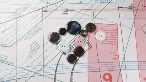 Tailoring accessories, buttons, patterns, on work table Video stock 148180302
