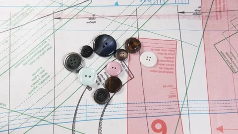 Tailoring accessories, buttons, patterns, on work table Видео 148180772