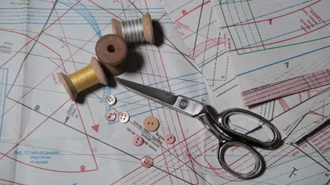 Tailoring accessories, tailor's scissors, models, spools of thread on the table Stock Footage 147732458