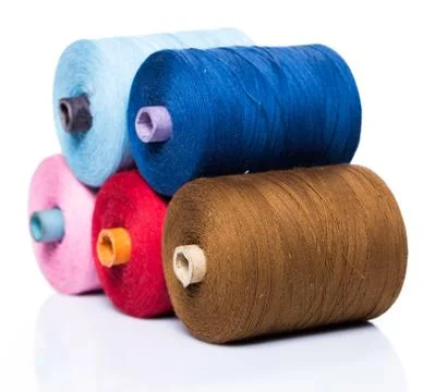 Tailoring. Colorful threads on white background Stock Photos