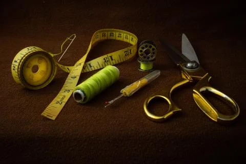 Tailoring materials on a brown background Stock Photos