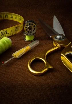 Tailoring materials on a brown background Stock Photos