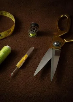 Tailoring materials on a brown background Stock Photos