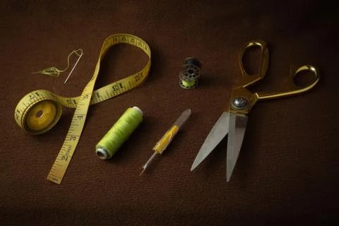 Tailoring materials on a brown background Stock Photos