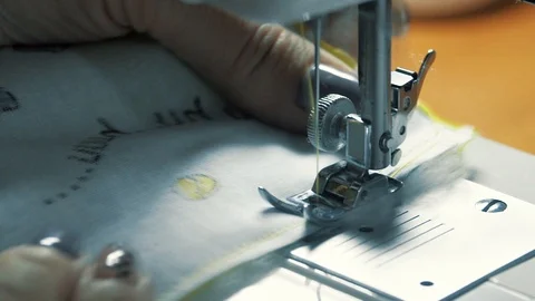 Tailoring Process - Women's hands behind her sewing, close-up Stock Footage 87499102