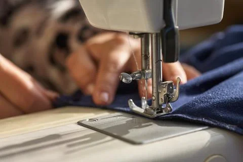 Tailoring Process - Women's hands behind her sewing Stock Photos