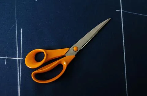 Tailoring scissors on the fabric Stock Photos