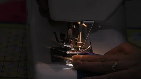 A tailoring studio and a sewing machine working on clothes with hands Stock Footage 112855097