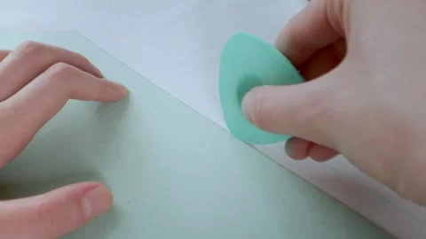 The tailor's hands are marking the pattern with chalk. Sewing and design of Stock Footage 269798776