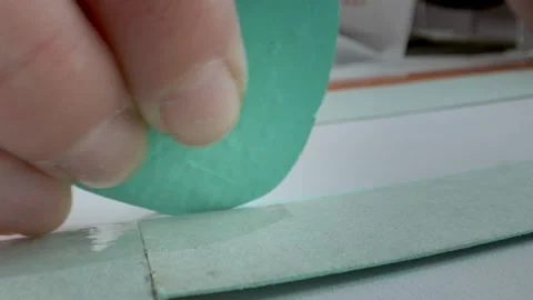 The tailor's hands are marking the pattern with chalk. Sewing and design of Video stock 269799873