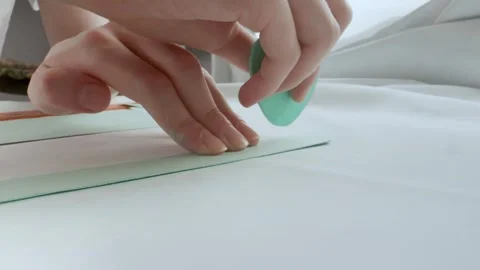 The tailor's hands are marking the pattern with chalk. Sewing and design of 스톡 동영상 269800672