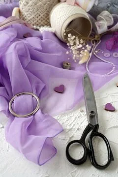 Tailor's scissors and threads on the fabric Stock Photos