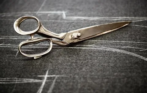 Tailors scissors on fabric Stock Photos