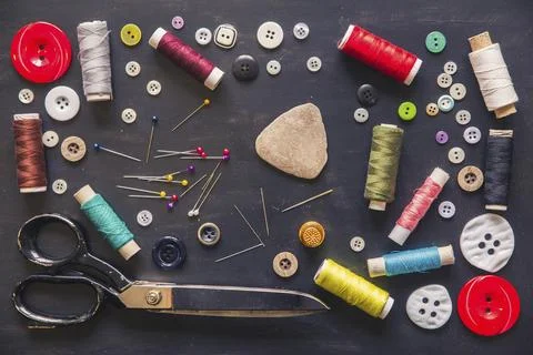 Tailor's set. Scissors, needles, threads, buttons, thimble and chalk Stock Photos