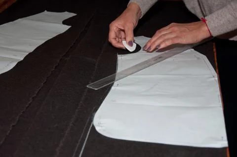 Tailor's work table with  cloth Stock Photos