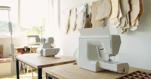 Tailor's workplace with sewing machine and patterns in atelier. Sewing business Stock Footage 200453547