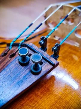 Tailpiece and strings of violin Stock Photos