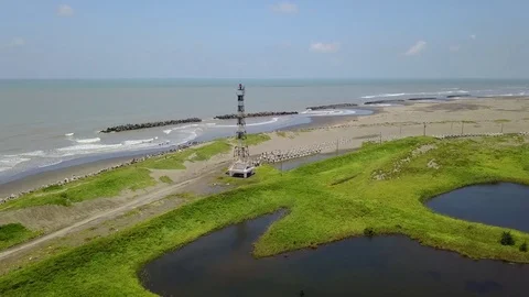 Tainan Aerial Drone Taijian National Park Guosheng lighthouse Bicycle trace Stock Footage