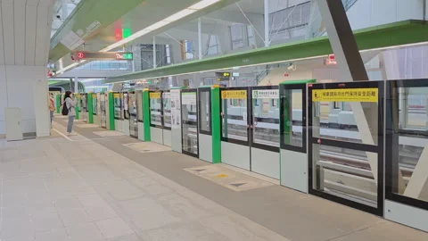 Taipei MRT train boarding at Siwei Elementary School Station with platform Stock Footage 334577309