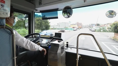 Taiwan Bus Driver driving through several intersection Video stock 107034685