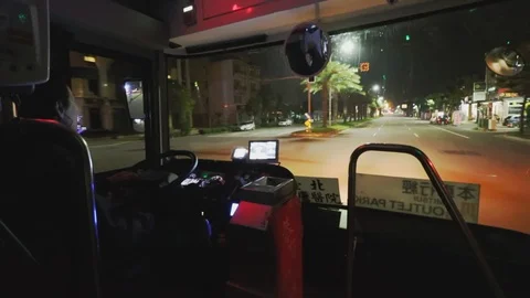 Taiwan Bus Driver driving through New Taipei City with light traffic at night Stock-Footage 107039146