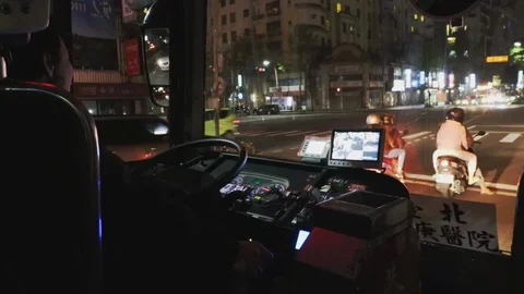 Taiwan Bus Driver driving through traffic jam during the night in New Taipei Stock Footage 107039567