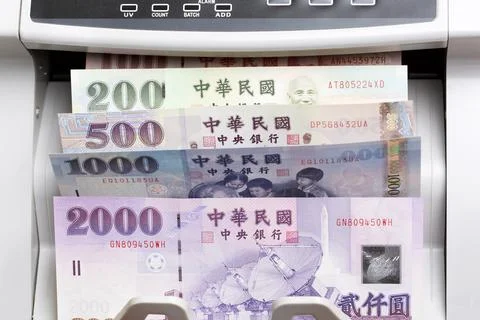 Taiwan dollar in a counting machine Stock Photos