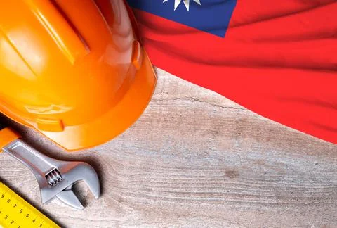 Taiwan flag with different construction tools on wood background Stock Photos
