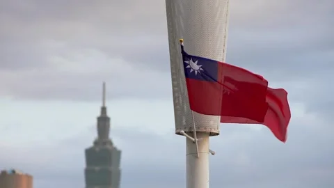 Taiwan flag fluttering in slow motion with Taipei 101 close-up Stock Footage 317027064