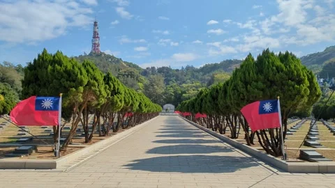Taiwan flags waving in winds at Mount Taiwu Military Cemetery in Kinmen Taiwan Stock Footage 321624470