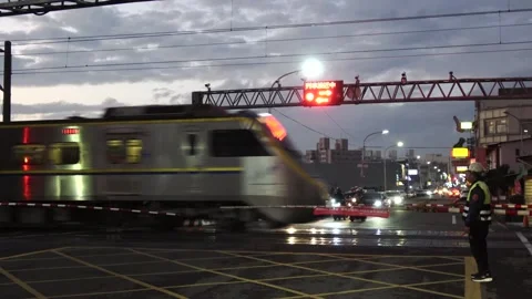A Taiwan local train crossing a level crossing in Changhua,Taiwan,02,01, 2025. Stock Footage 300663636