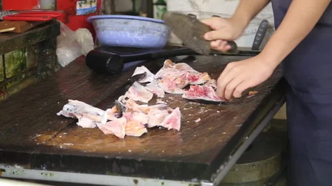 Taiwanese preparing fish at fish market Chiayi County Taiwan Stock Footage