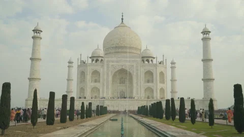 Taj Mahal In Agra India - Center Tilt Up From Water Reflection Bird Flying 4K Stock Footage