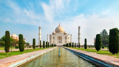 Taj Mahal front view reflected on the reflection pool. Stock Photos