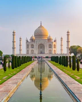 Taj Mahal front view reflected on the reflection pool. Stock Photos