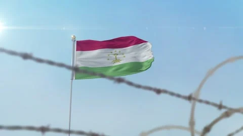 Tajikistan flag behind border Video stock 137439264