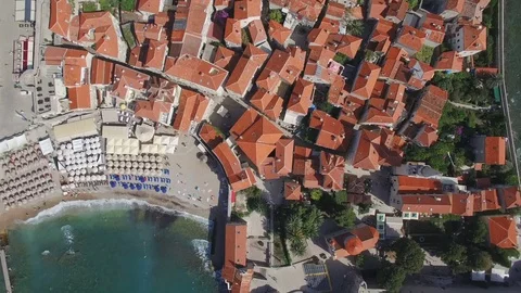 Take off and lift with camera rotation above red tile rooftops. Stock Footage 78006891