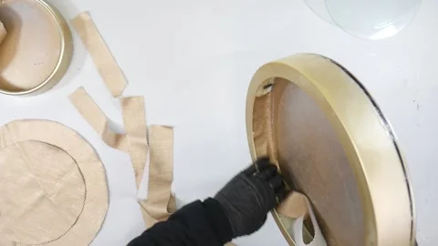 Take and make circle craft with beige cloth. Craft with top View. White table Stock-Footage 146238284