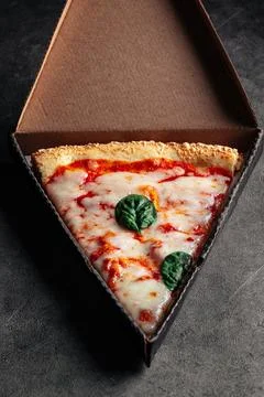 Take away box with slice of giant margherita pizza Stock Photos