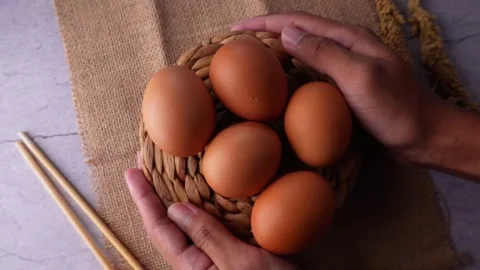 Take Back and Serving A Set of Egg on Straw Matting on Stone Table Stock Footage 265846831
