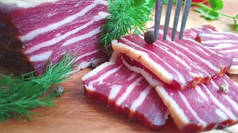 Take bacon with a fork, slow motion Stock Footage 108529012