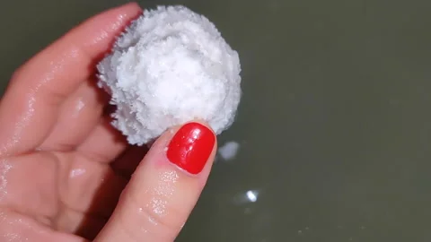 Take a bath with salt, a bath bomb. Stock Footage 150651141