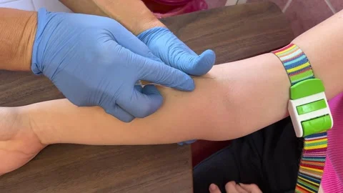 Take blood from a vein for analysis aboratory in clinic. Female lab assistant Stock Footage 276223501
