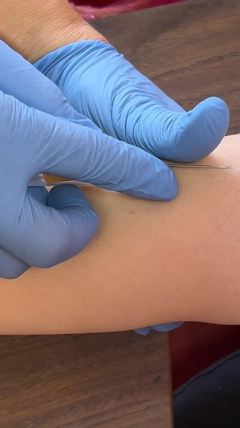 Take blood from a vein for analysis aboratory in clinic. Female lab assistant Stock Footage 276260492