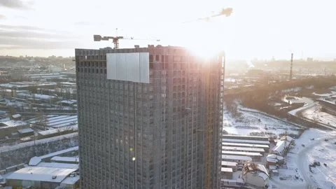 Take the camera up a building under construction with empty ceilings in the Stock Footage 166562236