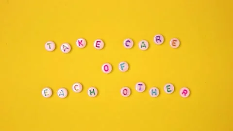 Take care of each other. Quote made of white round beads with colorful letter Stock Footage 196805749
