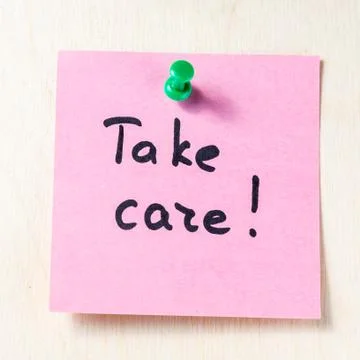 Take care note on paper post it Stock Photos