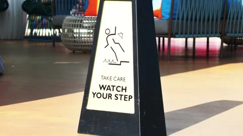 Take Care Watch Your Step Safety Sign on Luxury Resort Deck Video stock 345937151